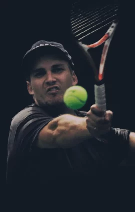 Matt hitting a really intense forehand in tennis